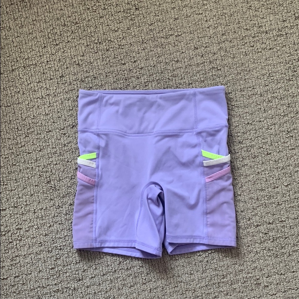 Purple fabletics biker shirts with colorful leash pockets!